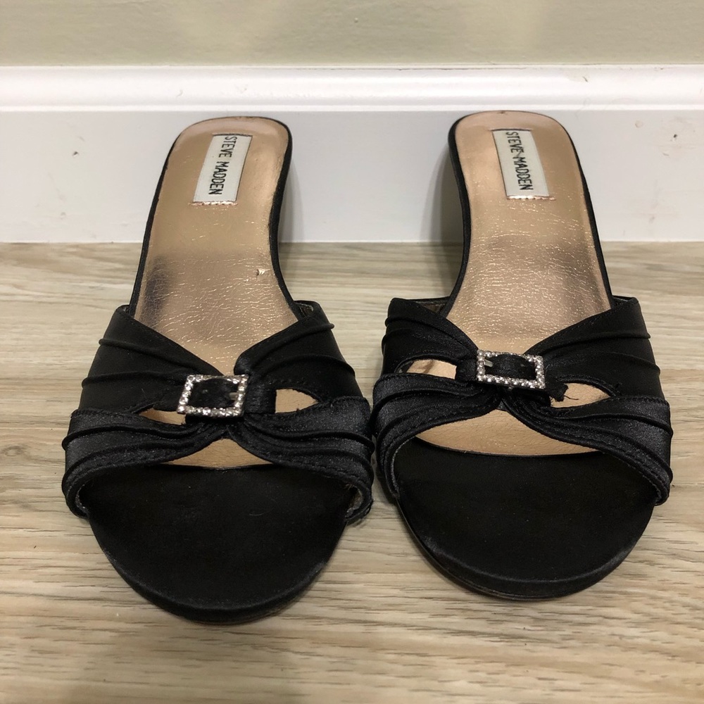 Black satin kitten heels with rhinestone buckle.